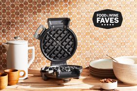 Cuisinart Vertical Waffle Maker displayed on wood surface against tile background