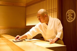 A chef at Sushi Saito in Toyko serving sushi