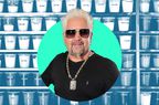 Guy Fieri in a photo composite in front of kitchen spices and seasonings. 