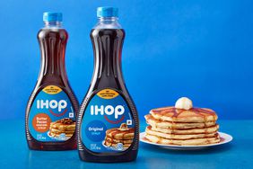 IHOP syrup bottles with a stack of pancakes.