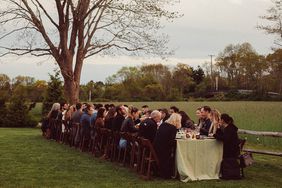 Guests dining outdoors at a Secret Supper dinner in Sagaponack.