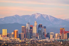 A skyline view of Los Angeles, California with mountains in the background