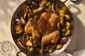 Roast Chicken with Potatoes, Shallot, and Lemon in a dutch oven