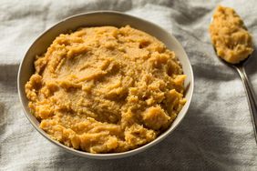 Organic Japanese Miso Paste in a bowl and next to a spoonful of miso paste. 