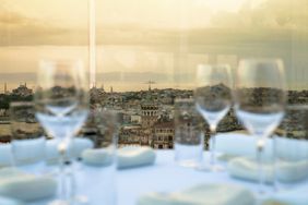 Rooftop views seen through wine glasses at Mikla in Istanbul.